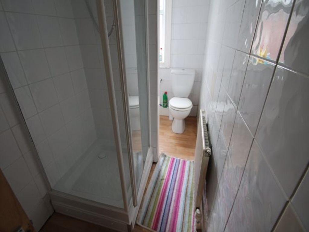 A clean and well-maintained bathroom featuring ...