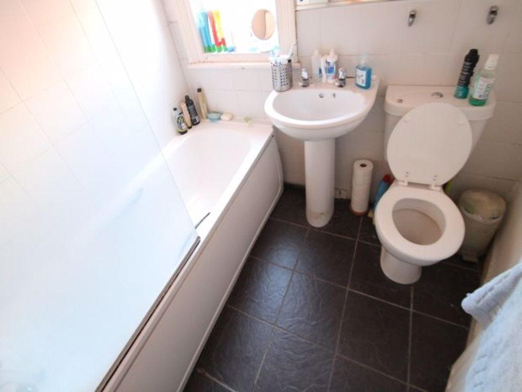 Clean and neatly maintained bathroom with moder...