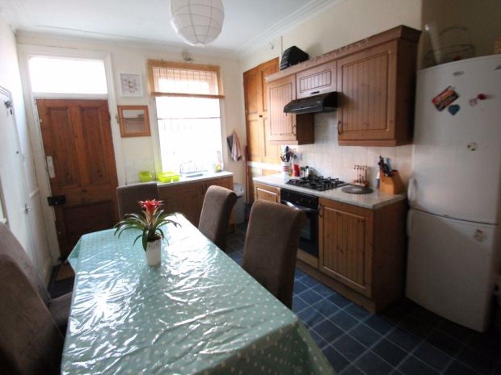 A well-maintained kitchen featuring wooden cabi...