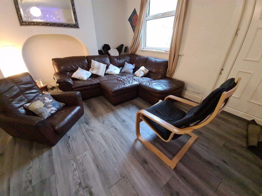 A spacious and inviting living room featuring c...