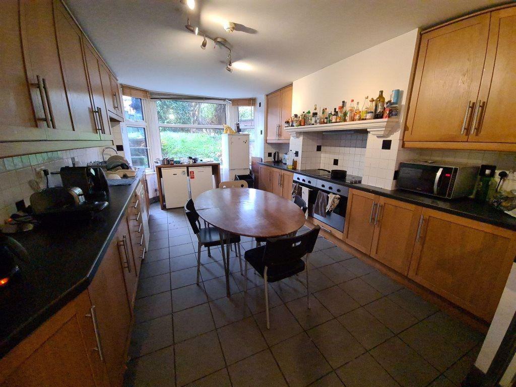 A well-maintained kitchen with ample natural li...