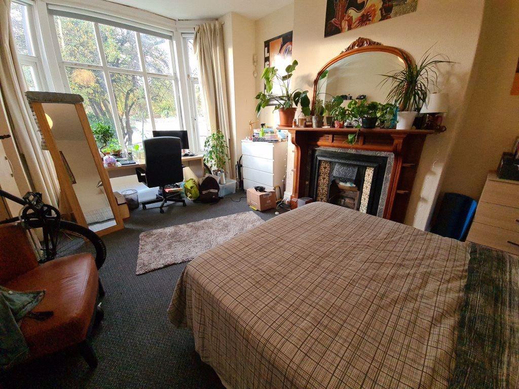 A bright and welcoming living room with large w...