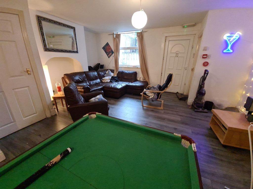 Spacious and modern living room featuring comfo...