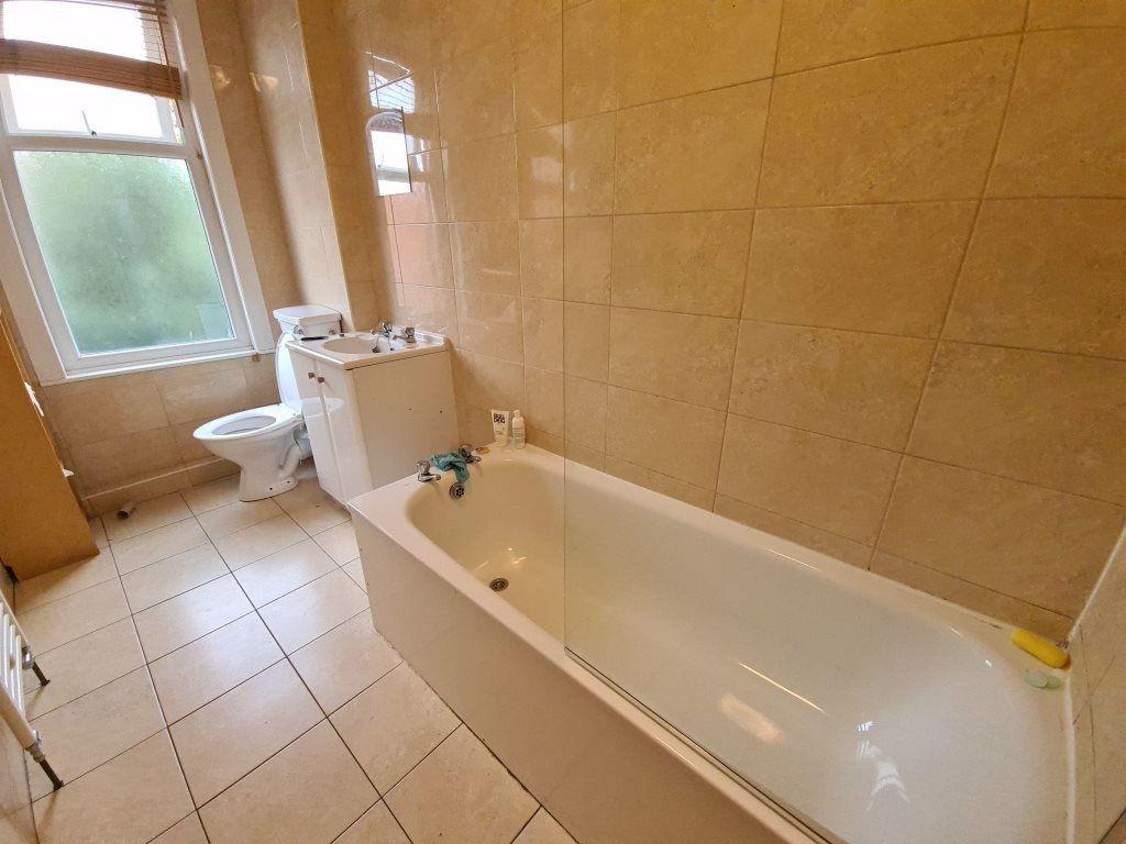 A clean and well-maintained bathroom with a lar...
