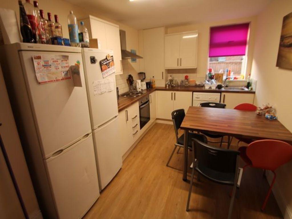 A bright, well-maintained kitchen area with amp...