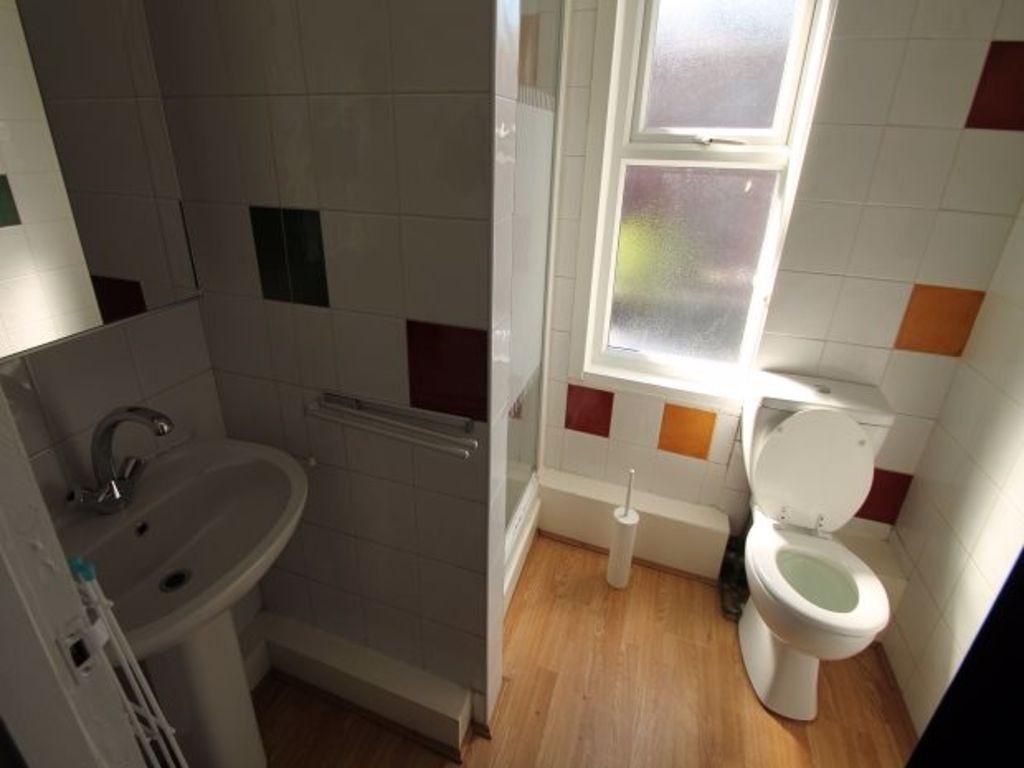 Bright and clean bathroom with a large window p...