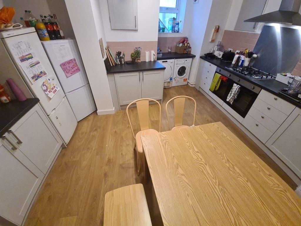 A bright, modern kitchen with ample counter spa...