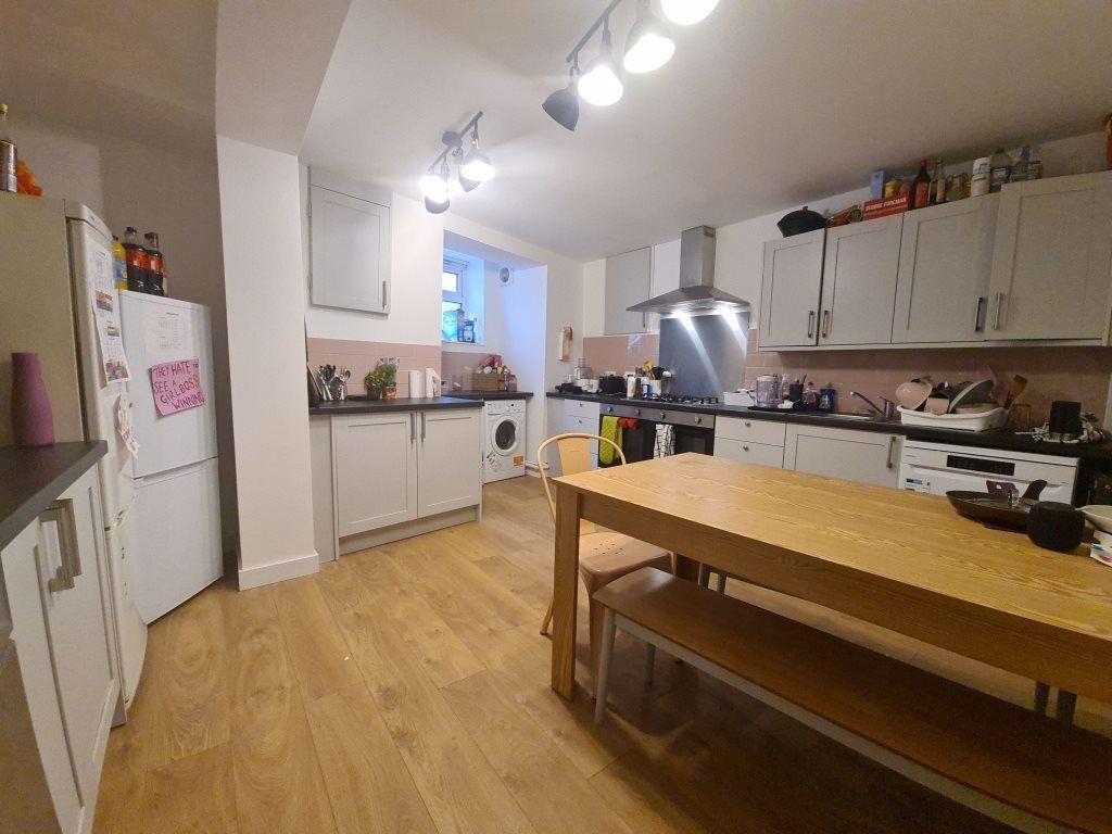 A bright and modern kitchen with ample counter ...