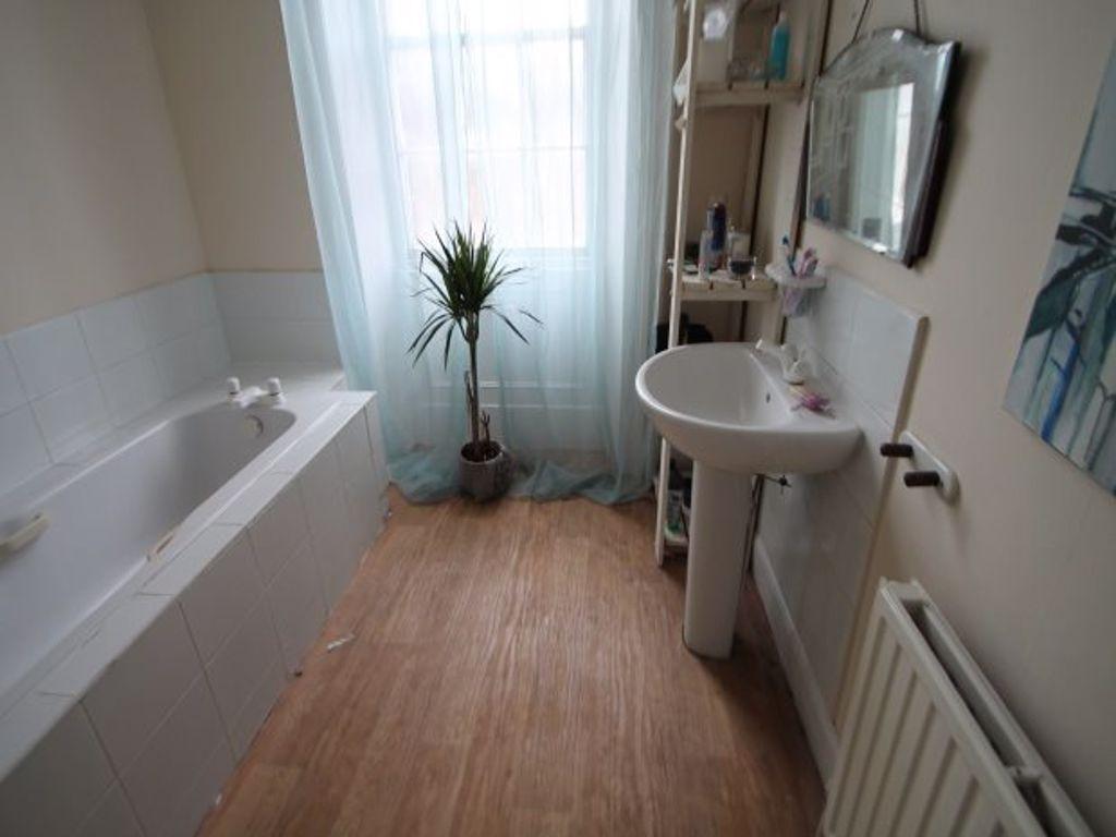 A clean and well-maintained bathroom featuring ...
