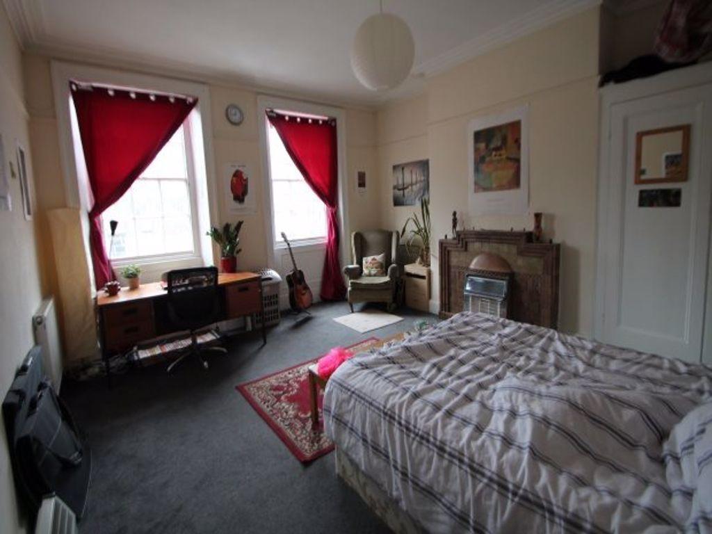 Bright and spacious master bedroom featuring a ...