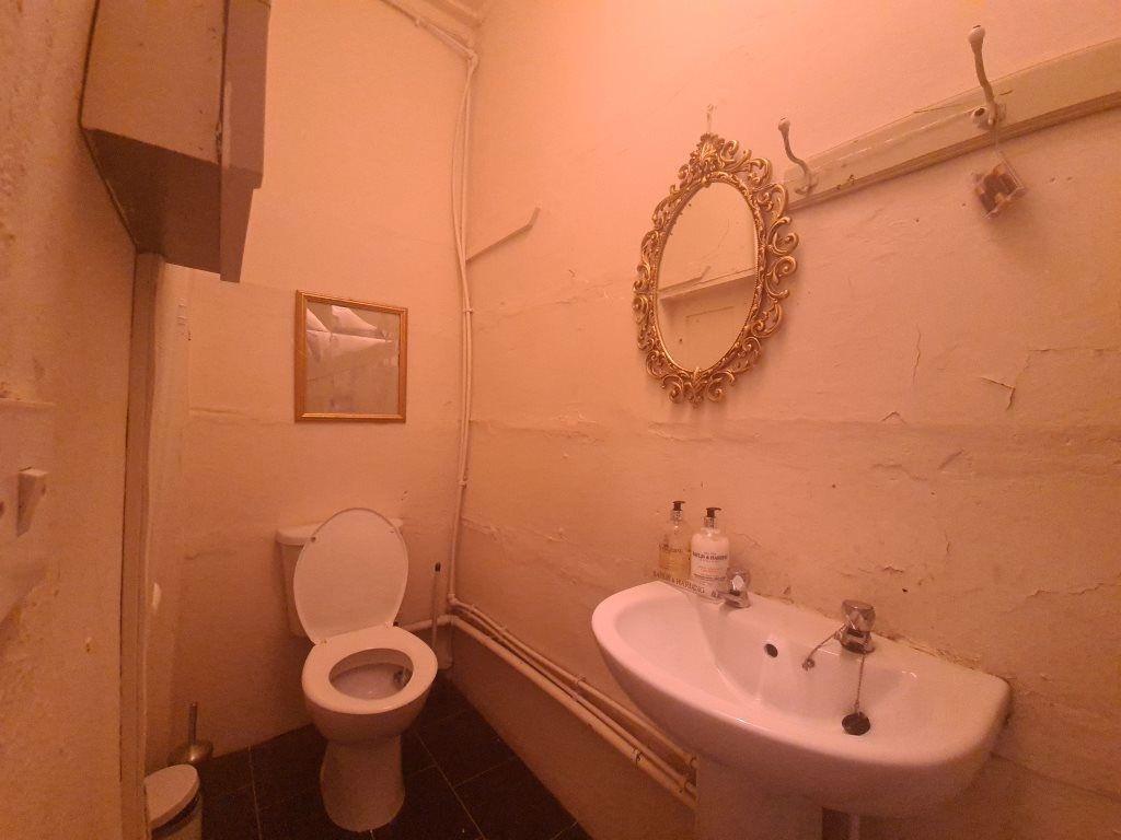 A well-maintained bathroom with a toilet and si...