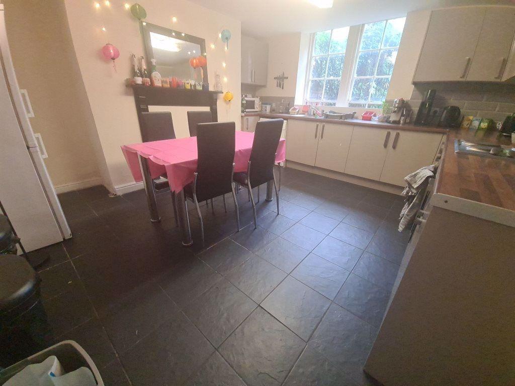 A bright and welcoming kitchen area with ample ...