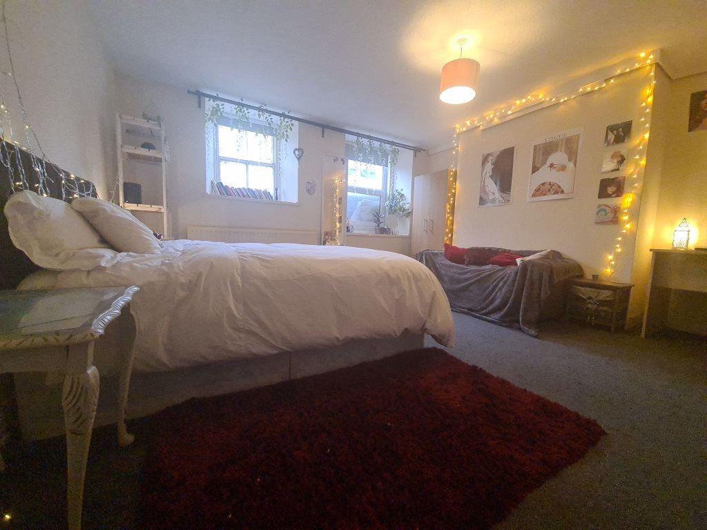 A spacious and well-maintained master bedroom f...