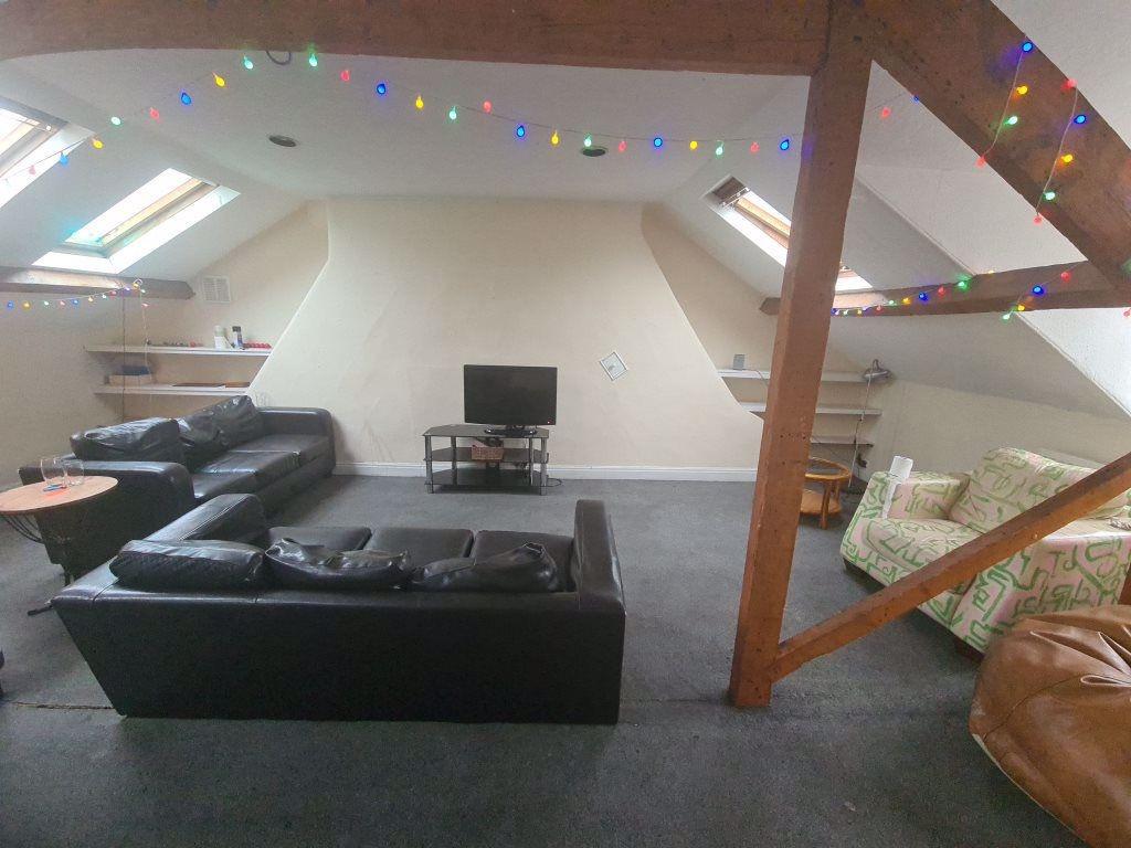 A spacious and inviting contemporary living roo...