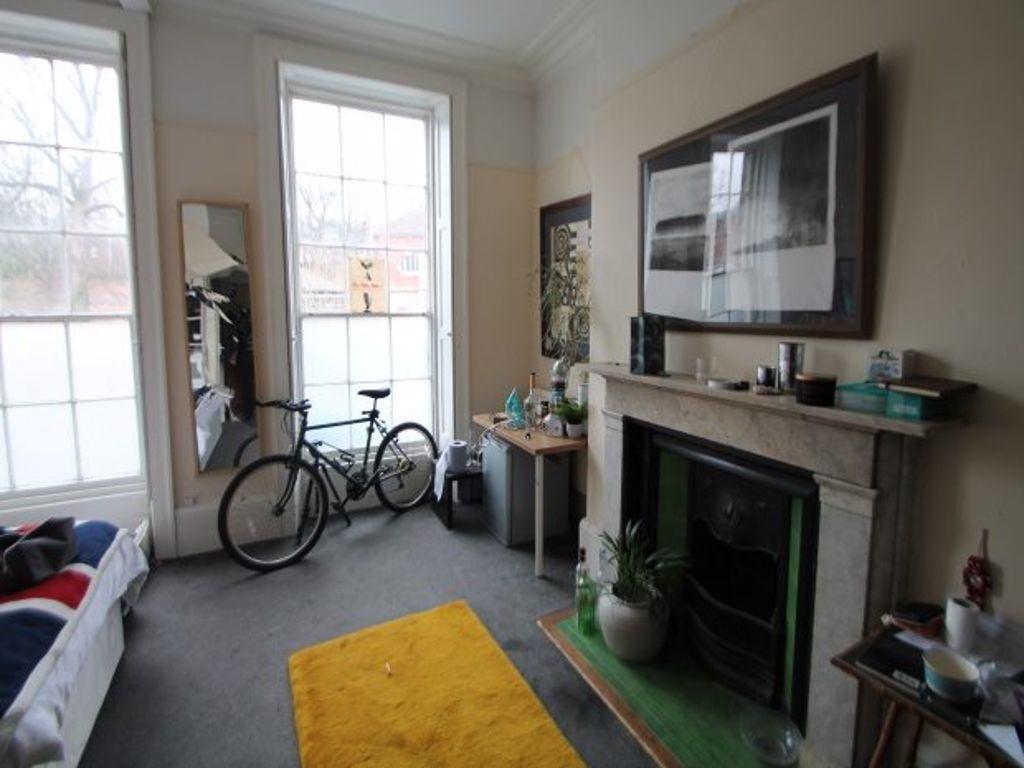 A bright and inviting living room with large wi...