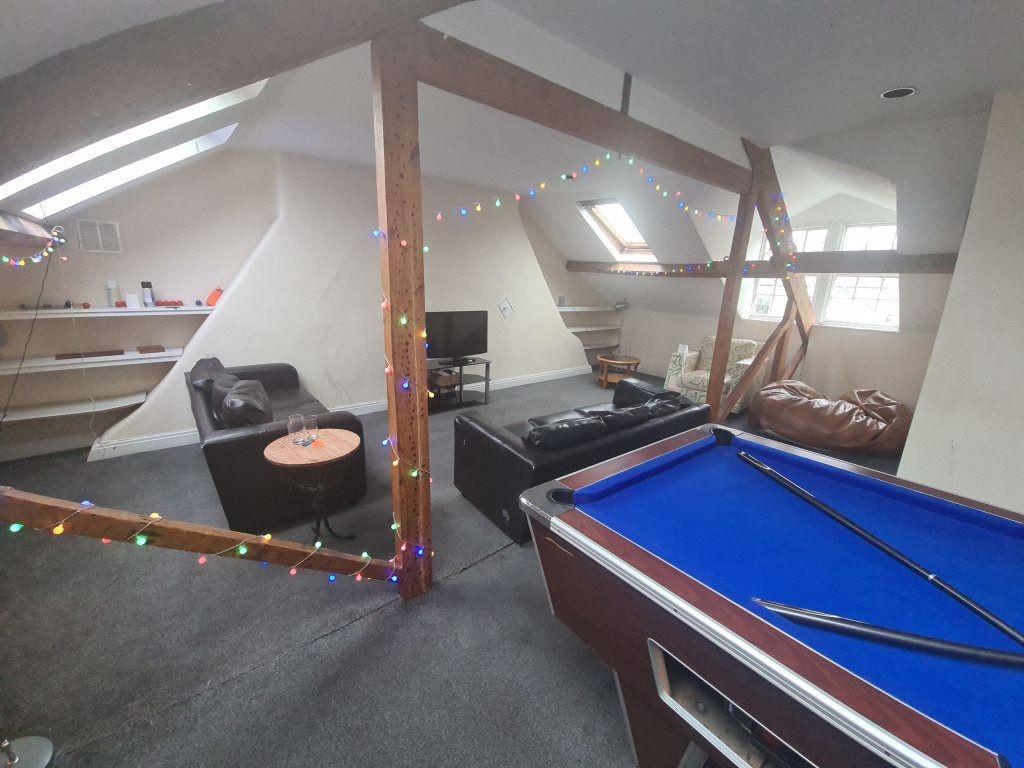 A spacious and modern living area featuring a b...