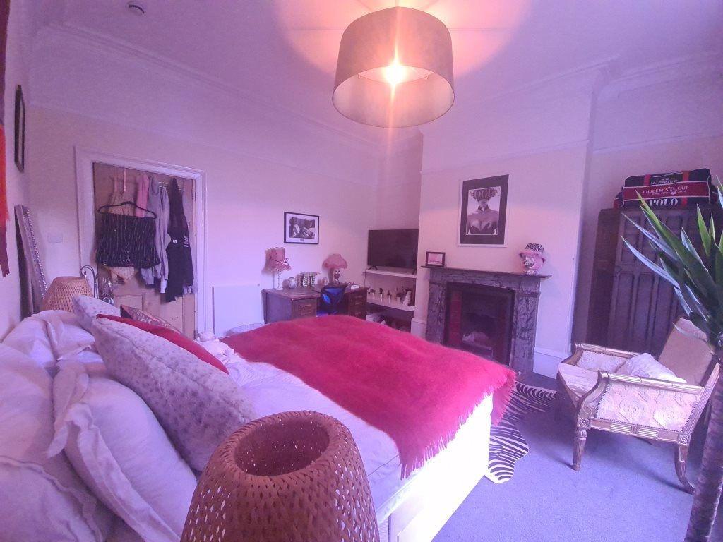 A spacious and well-maintained master bedroom f...