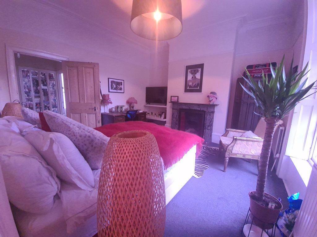 Bright and inviting living room with large wind...