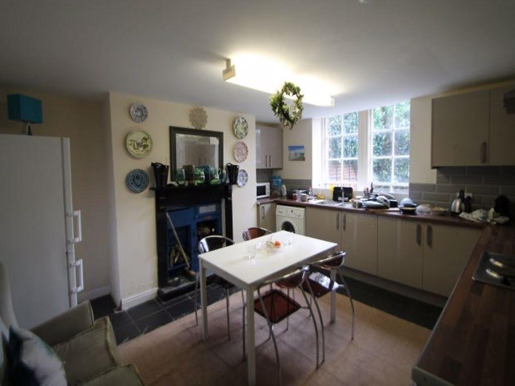 A well-lit, modern kitchen with ample counter s...