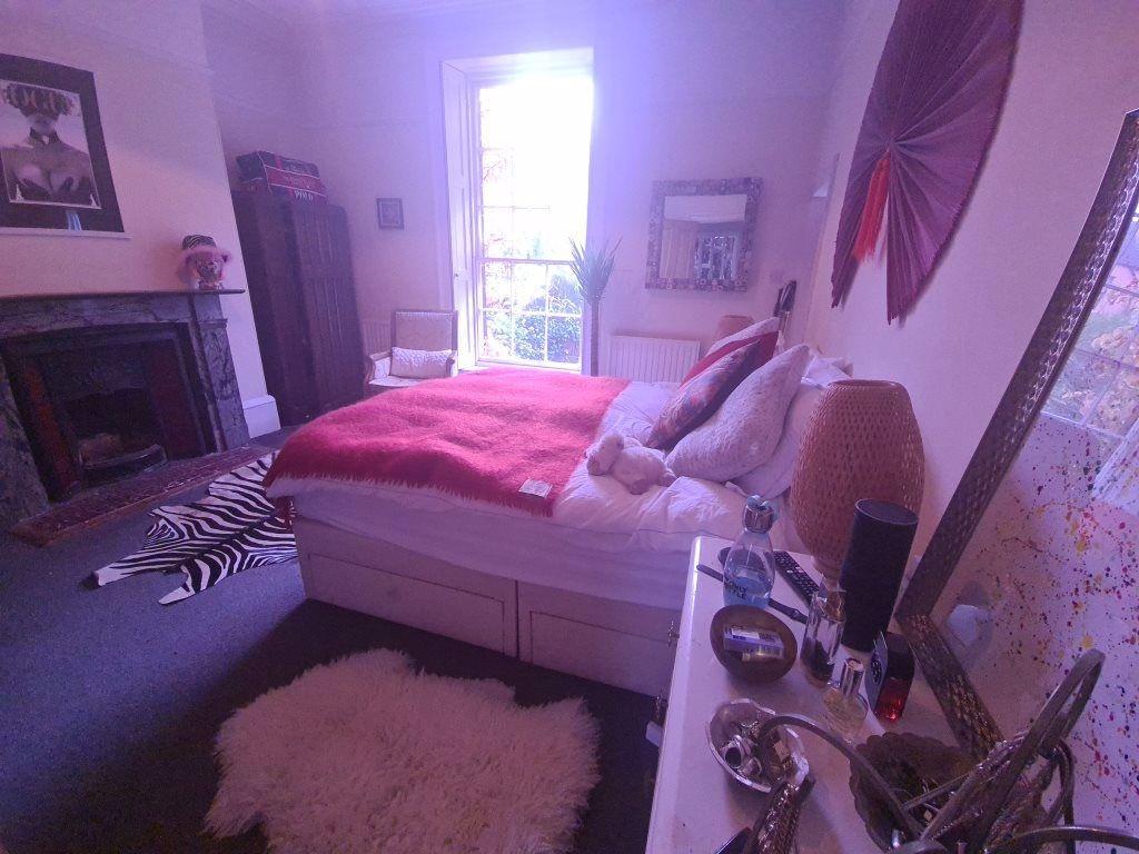 A spacious and well-maintained master bedroom f...