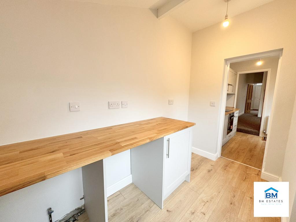 Utility room facing kitchen