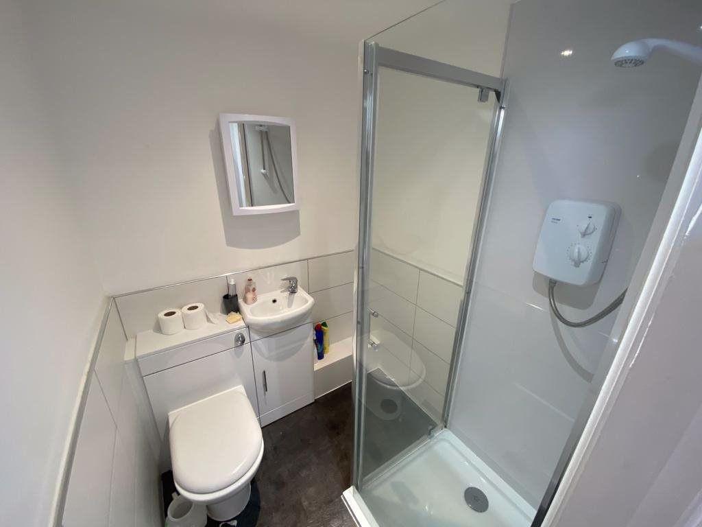 A clean and well-maintained bathroom featuring ...