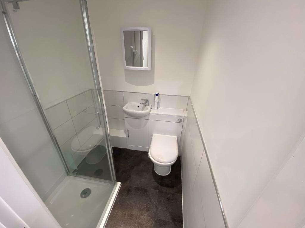A clean and well-maintained bathroom featuring ...