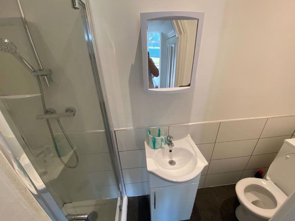 A clean and well-maintained bathroom with a spa...