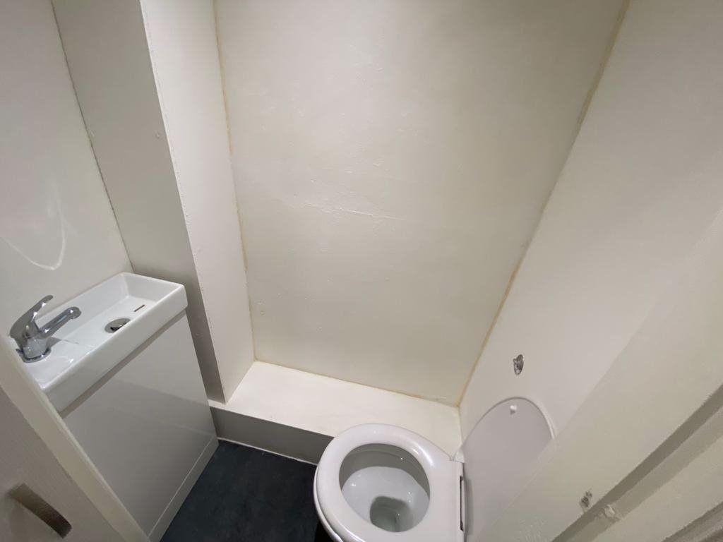 A clean and modern bathroom with a sizeable bat...