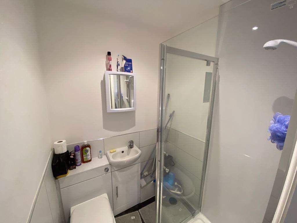 A clean and modern bathroom featuring a shower ...