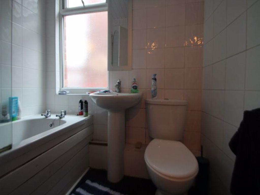 A clean and functional bathroom featuring a bat...