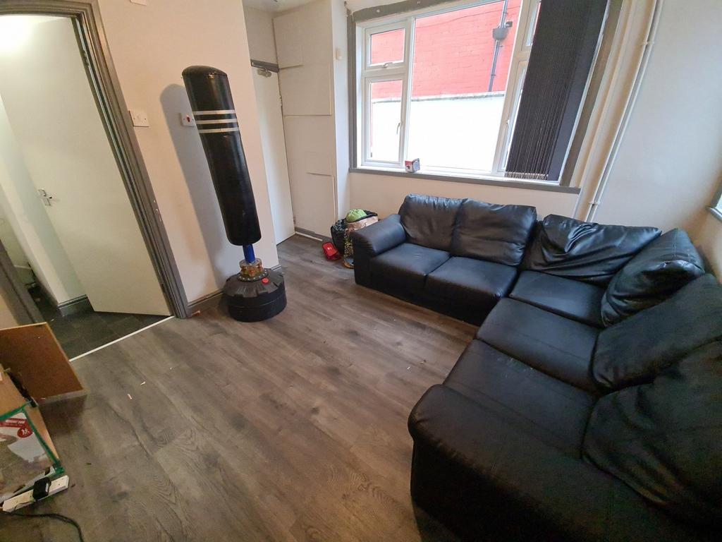 A spacious and comfortable living room with a m...
