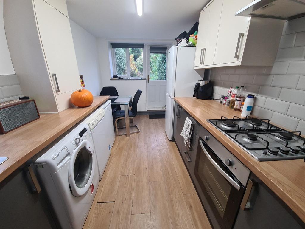 A modern, bright kitchen with ample natural lig...