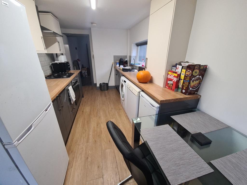 Bright and modern kitchen with ample counter sp...