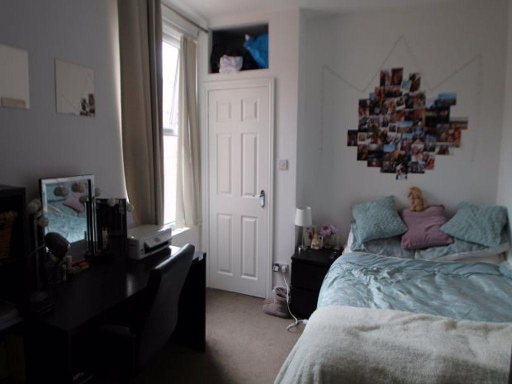 A cozy bedroom featuring a double bed with plus...
