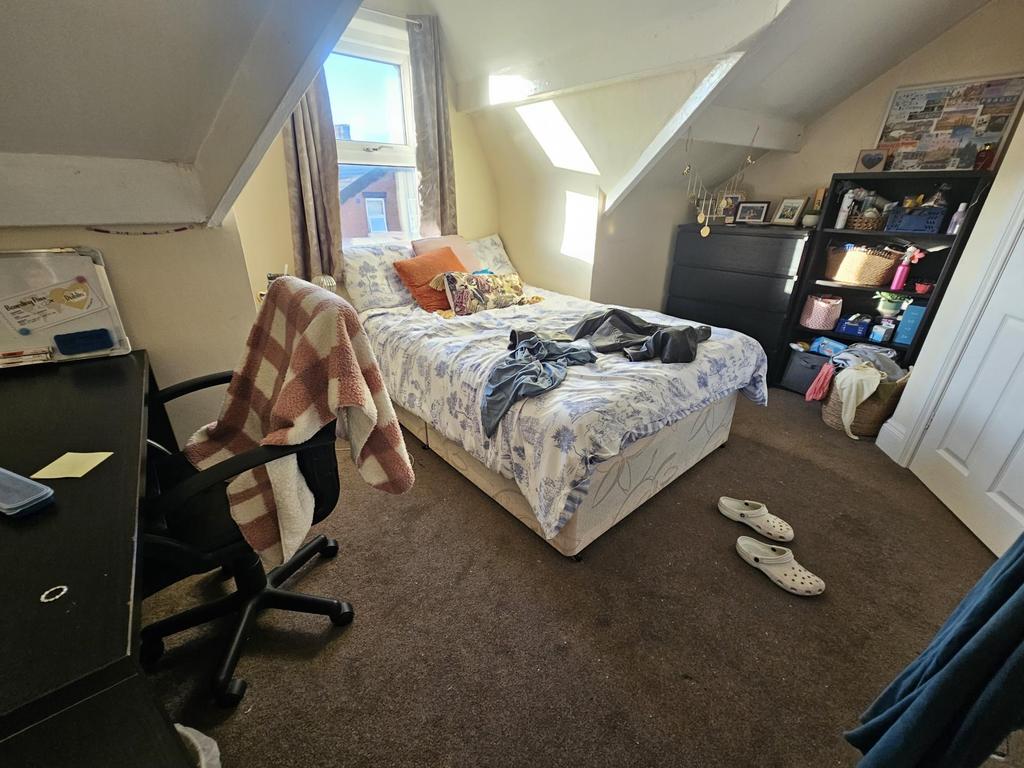 Bright, cozy attic double bedroom with sloped c...