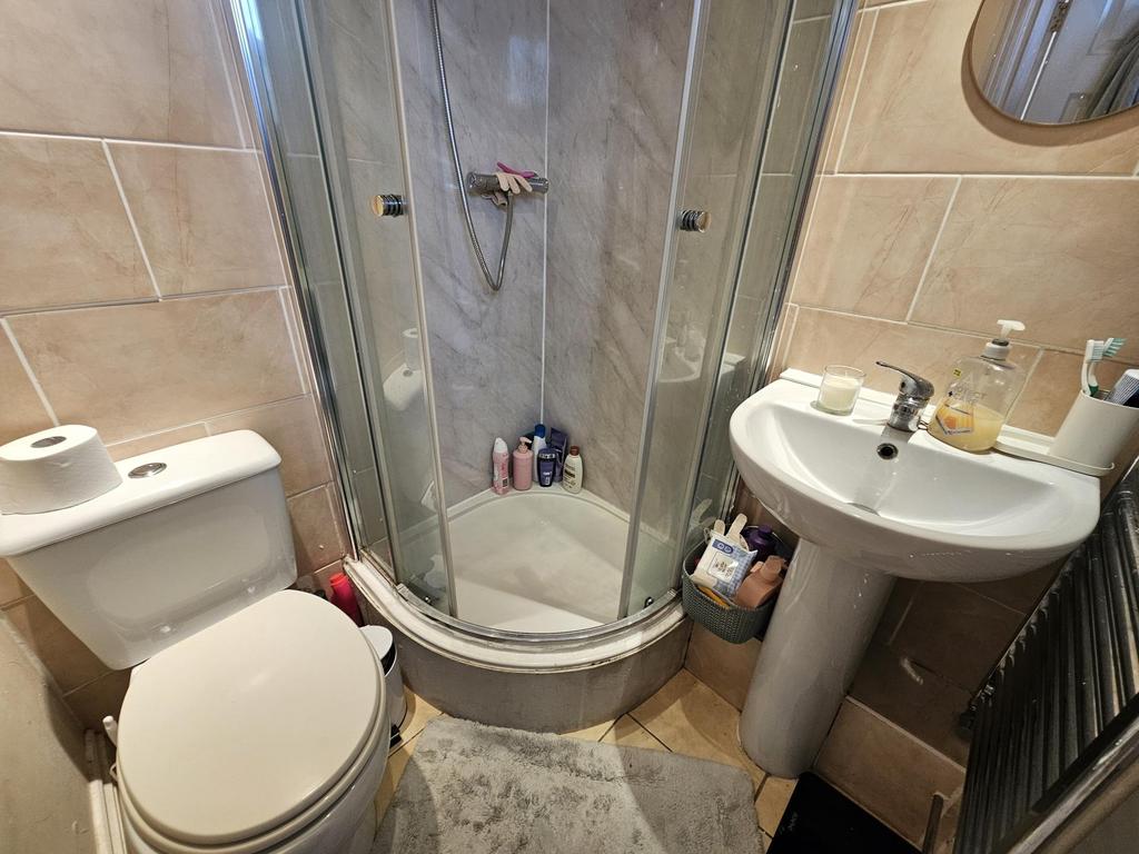 Bright, well-maintained bathroom featuring a co...