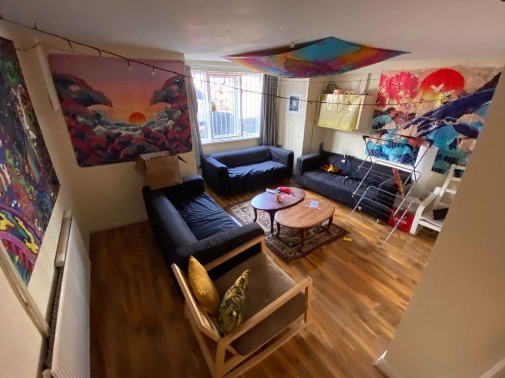 A vibrant, modern living room featuring comfort...