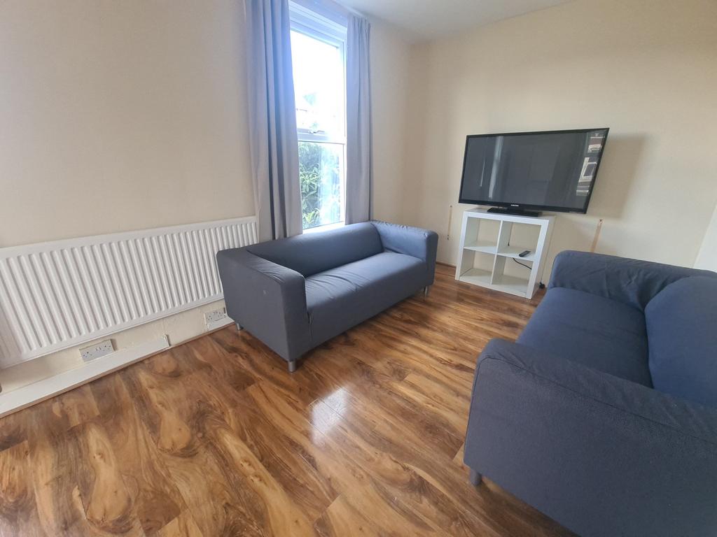 A bright and cozy living room featuring two com...