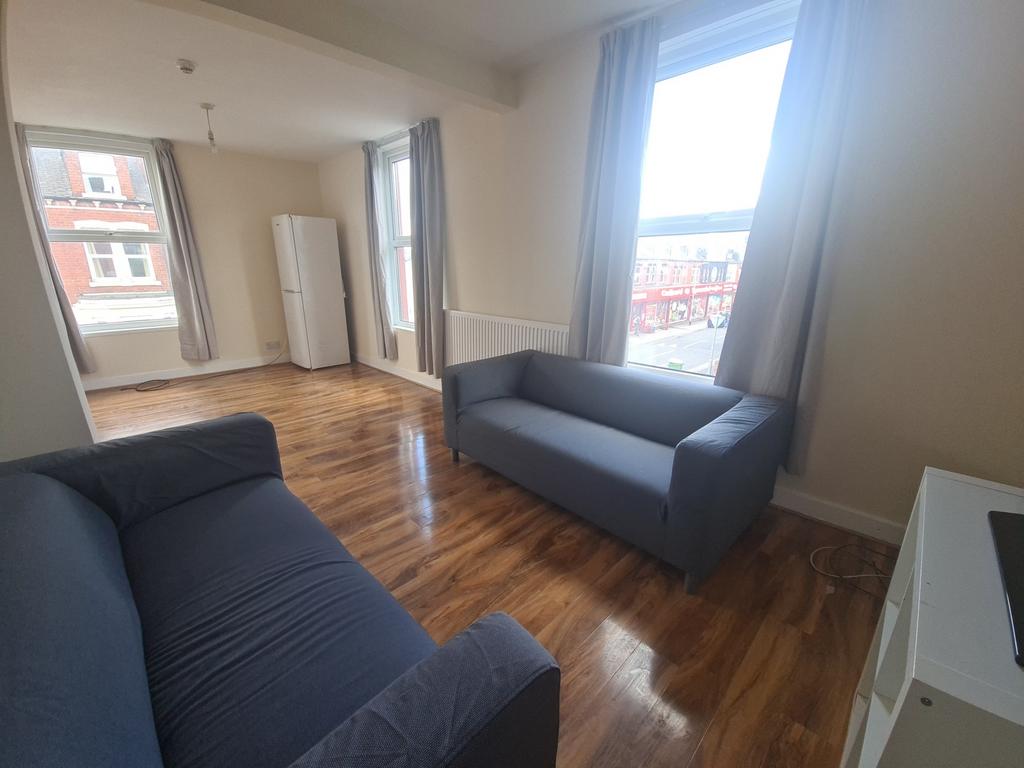 Bright and welcoming living room featuring larg...