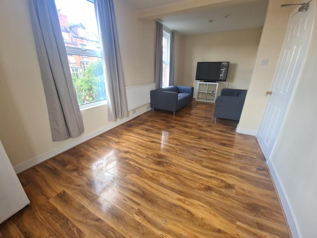 A spacious and well-maintained living room feat...