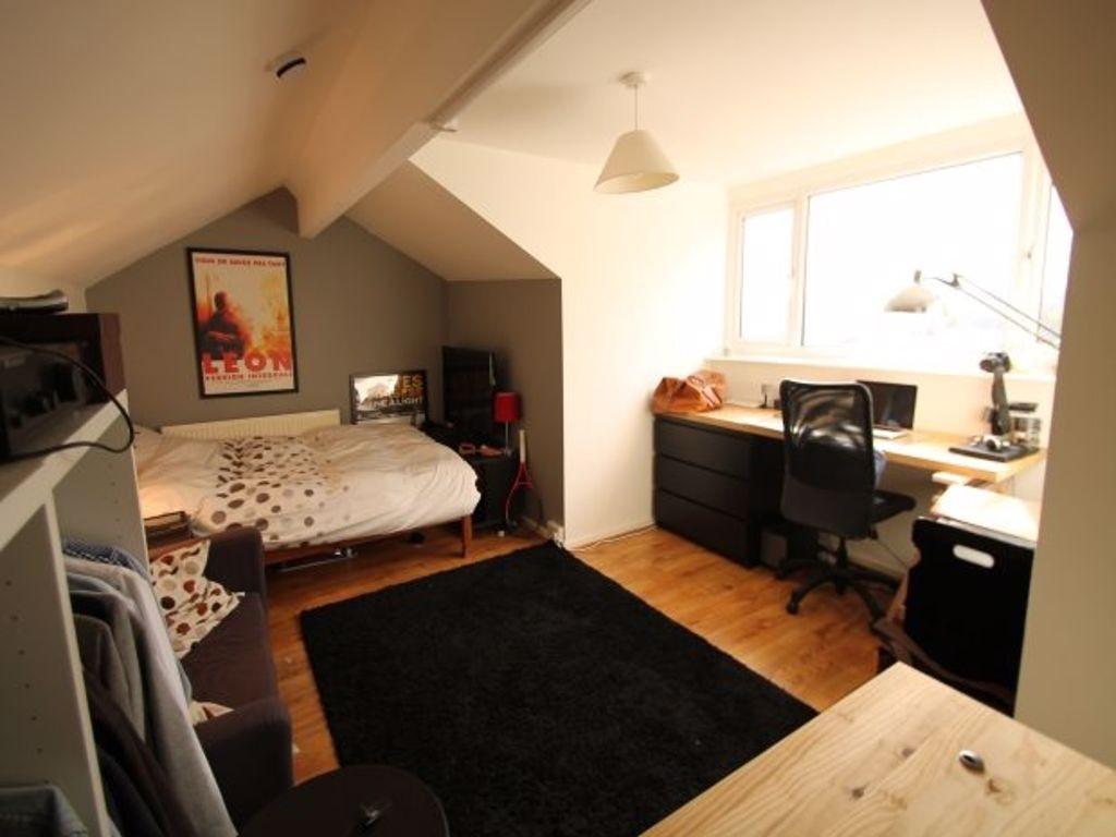 A bright and inviting double bedroom featuring ...