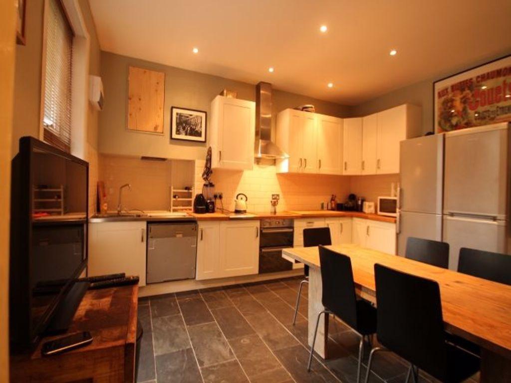 Bright and modern kitchen with ample counter sp...