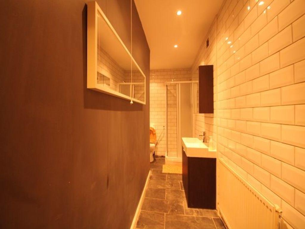 A well-maintained bathroom featuring a clean, m...