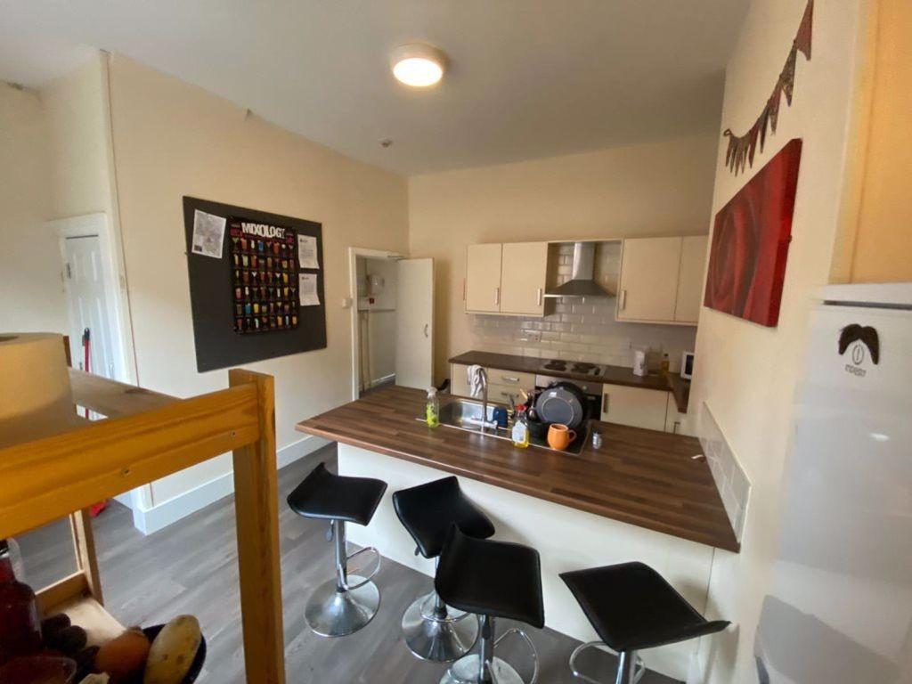 A modern, well-lit living room featuring a spac...