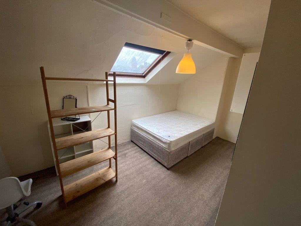 A small, tidy private bathroom area with a mode...