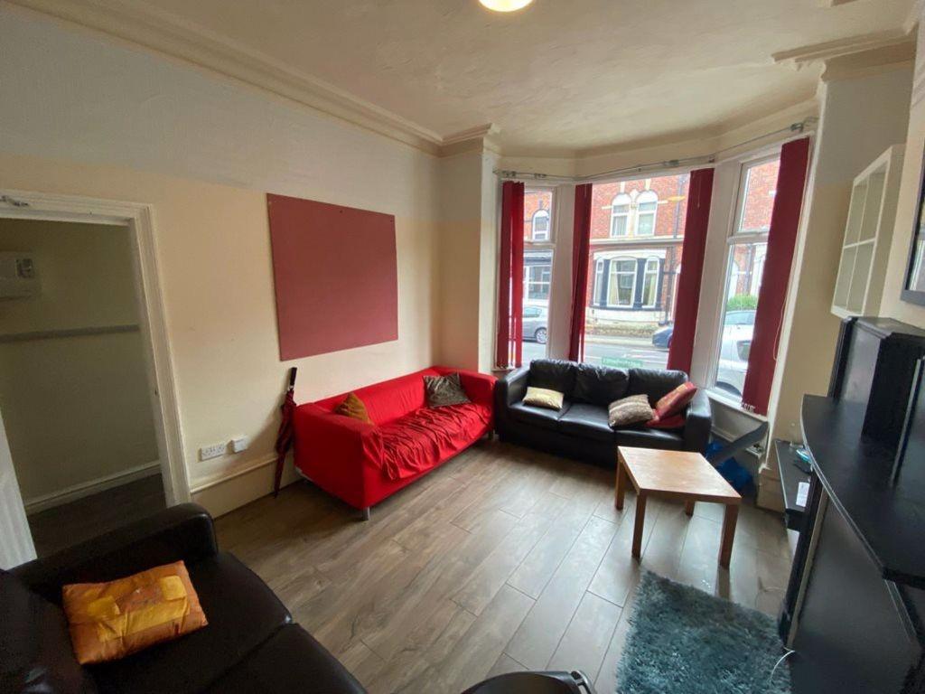 Bright and welcoming living room featuring a bo...