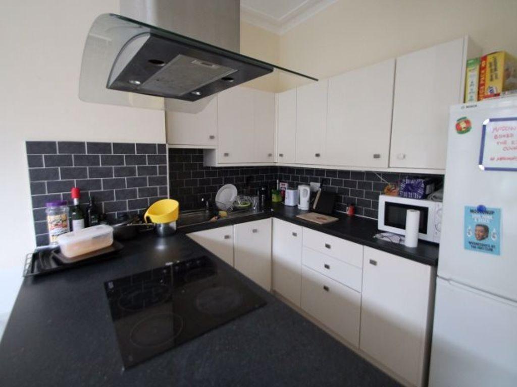 A clean and modern kitchen with well-organized ...