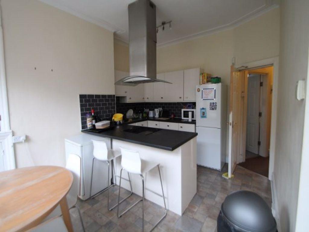 Bright and functional kitchen area featuring mo...