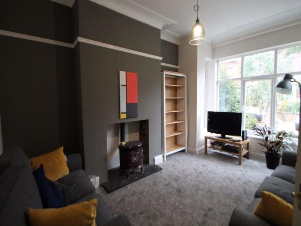 A bright and spacious living room featuring a l...